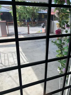 a view from a window looking out at a street at Homestay Lestary near Taiping Fast WIFI Netflix in Taiping