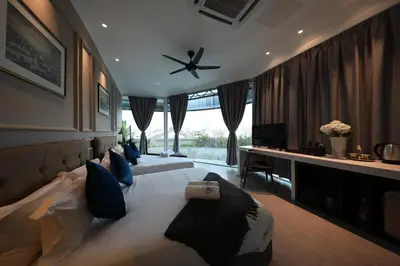 a bedroom with two beds and a ceiling fan at Manhattan Residence in George Town