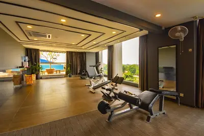 a gym with cardio equipment in a hotel room at Kinta Riverfront Hotel & Suites in Ipoh