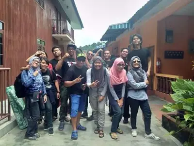 a group of people posing for a picture at Nipahmas Chalet in Pangkor