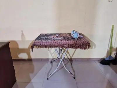 a table with a rug on top of it at Nipahmas Chalet in Pangkor