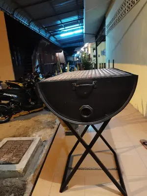 a bowl on a stand in a room with motorcycles at Nipahmas Chalet in Pangkor