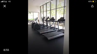 a row of treadmills in a gym at By the sea Beach BABY in Batu Ferringhi