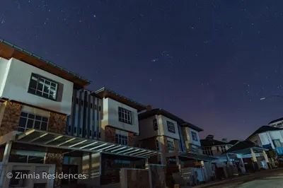a row of houses at night under a starry sky at Zinnia Residence Tanah Rata in Cameron Highlands