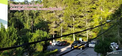 a parking lot with a bunch of cars parked at Cameron Highlands Muslim Apartment by AziziCameron in Cameron Highlands