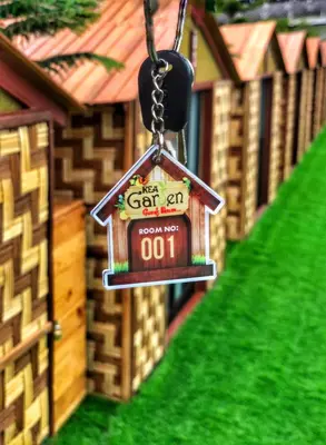 a bird house ornament hanging from a chain at Kea Garden Mini Chalet in Cameron Highlands