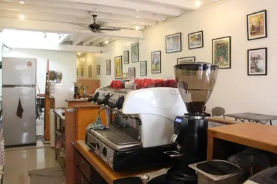 a kitchen with a blender on a table with a counter at 24 Kimberley in George Town