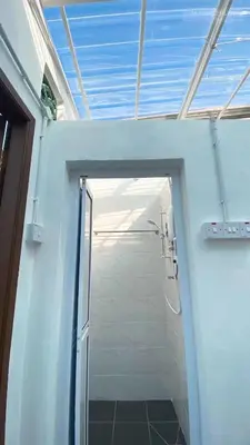 a shower with a glass door in a bathroom at 24 Kimberley in George Town