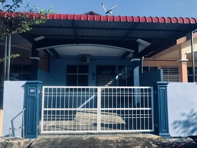 a white gate in front of a house at Abg Long Fadhil Homestay in Sungai Petani
