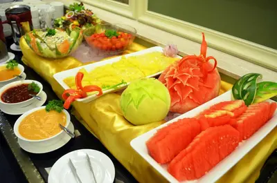 a table topped with different types of sushi and vegetables at Hotel Sentral Georgetown @ City Centre in George Town