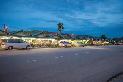a street with cars parked on the side of a road at Northern Lodge Hotel in Sungai Petani