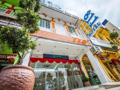 a store front of a building with a vase in front at 118 Hotel,Dato Keramat - Self Check In in George Town