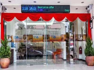 a store front with red drapes and a car in the window at 118 Hotel,Dato Keramat - Self Check In in George Town