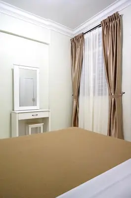 a bedroom with a bed and a television at Cameron View Apartment @ Crown Imperial Court Brinchang in Cameron Highlands