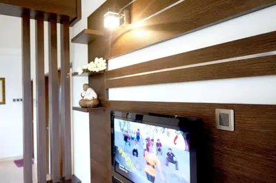 a tv in a living room with a wall at Cameron View Apartment @ Crown Imperial Court Brinchang in Cameron Highlands