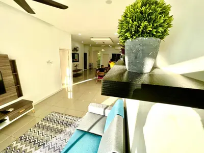 a living room with a plant on a table at Home Away from Home in Taiping - 3R4B Family & Group Friendly! in Taiping
