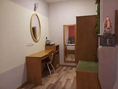 a dressing room with a desk and a mirror at K GARDEN HOTEL (IPOH) SDN BHD in Ipoh