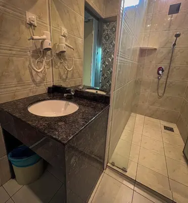 a bathroom with a sink and a shower at K GARDEN HOTEL (IPOH) SDN BHD in Ipoh