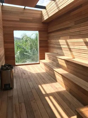 a wooden room with a window in a sauna at Rock Mountain in Raub