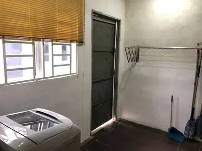 a bathroom with a basketball hoop and a toilet at Makmur homestay in Taiping