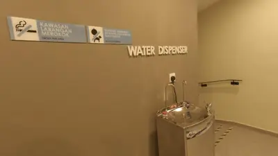 a bathroom with a water dispenser on the wall at U Design Hotel Kuala Lipis in Kuala Lipis