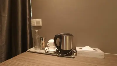 a coffee maker on a tray on a table at U Design Hotel Kuala Lipis in Kuala Lipis