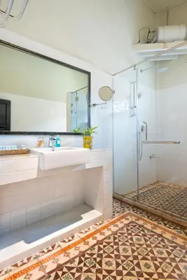 a bathroom with a sink and a shower at Noordin Mews in George Town