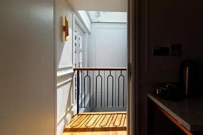 an open door to a balcony with a window at White Mansion Penang in George Town