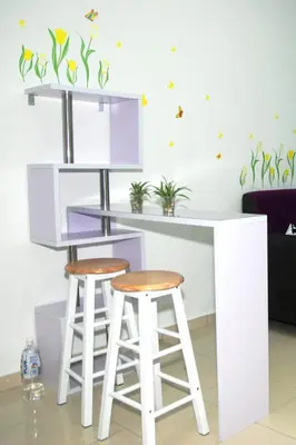 a kitchen with a purple counter and two stools at Qstay Sitiawan Townhouse (Minnie Dreams) - \u7c73\u59ae\u68a6 in Sitiawan