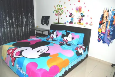 a bedroom with a winnie the pooh bed at Qstay Sitiawan Townhouse (Minnie Dreams) - \u7c73\u59ae\u68a6 in Sitiawan
