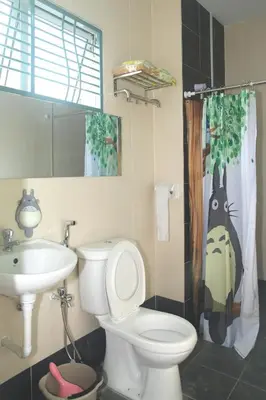 a bathroom with a toilet and a sink at Qstay Sitiawan Townhouse (Totoro Dreams) - \u68a6\u89c1\u9f99\u732b in Sitiawan