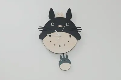 a clock with a cat and a rabbit at Qstay Sitiawan Townhouse (Totoro Dreams) - \u68a6\u89c1\u9f99\u732b in Sitiawan