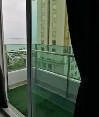 a window with a view of a building at Mansion One by Sky Hive in George Town