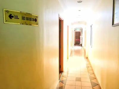 a hallway with a sign on the side of a building at Hotel Sri Raub in Raub