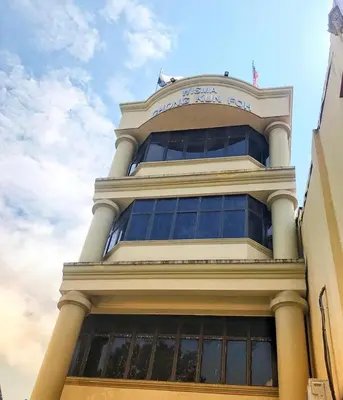 a tall building with a sign on top of it at Hotel Sri Raub in Raub