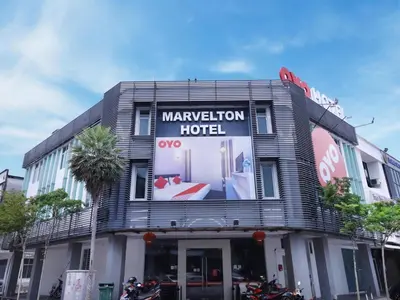 a hotel with a sign on the front of it at Hotel O Marvelton Hotel in Butterworth