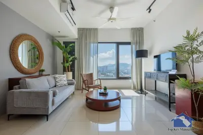 a living room with a couch and a table at Tropicana 218 Macalister in George Town