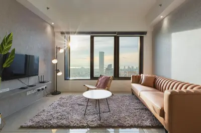 a living room with a couch and a table at Tropicana 218 Macalister in George Town