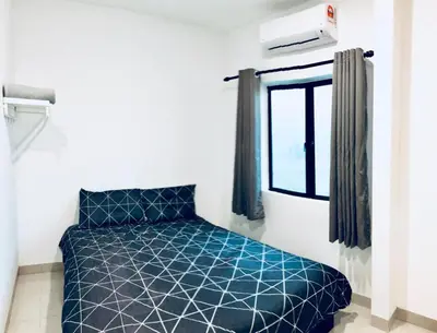 a bedroom with a blue bed and a window at LunaStay (Shared Common Area) in Lunas