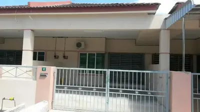 a house with a gate in front of it at Homestay Kuala Kangsar in Kuala Kangsar