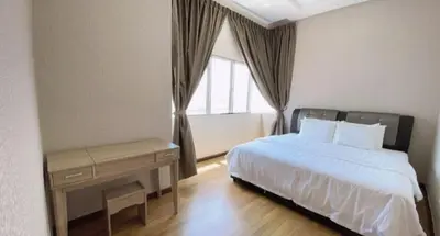 a bedroom with a bed and a desk and a window at Sekinchan HighView Penthouse 15pax 5R5B \u9876\u5c42\u516c\u5bd3 \u770b\u6d77 \u770b\u7a3b\u7530\u666f in Sekincan