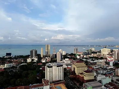 a view of a city with buildings and the water at Georgetown City View Condo Tropicana 218 Macalister in George Town