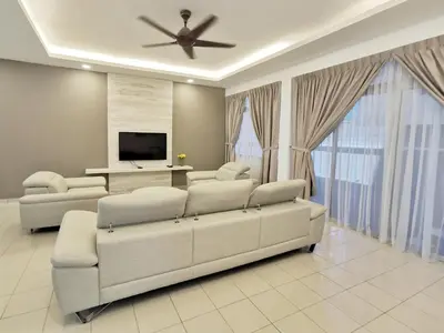 a living room with two couches and a television at 3 Concordia @ Gurney in George Town