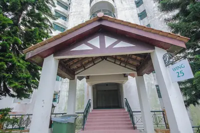 an entrance to a building with a sign that reads nursing at Fun Apartment @ Equatorial Hill Resort in Cameron Highlands