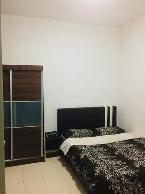 a bedroom with a bed and a glass door at Ainul MarDhiah @ Cameron Highland (muslim stay) in Cameron Highlands