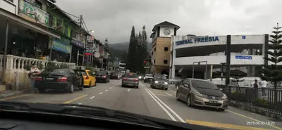 a busy city street with cars driving down the road at D'Puncak Arabella Muslim Homestay in Cameron Highlands