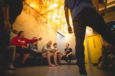 a group of people sitting on a couch in a room at Traveller Bunker Hostel 1 in Cameron Highlands