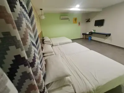 a hospital room with a bed and a curtain at Hotel Bestari in Kuala Lipis