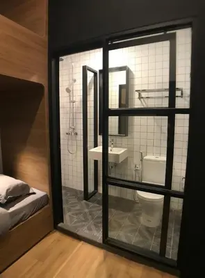 a bathroom with a toilet and a sink at Kooning in George Town