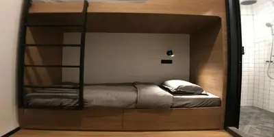 a room with a bunk bed in a bathroom at Kooning in George Town